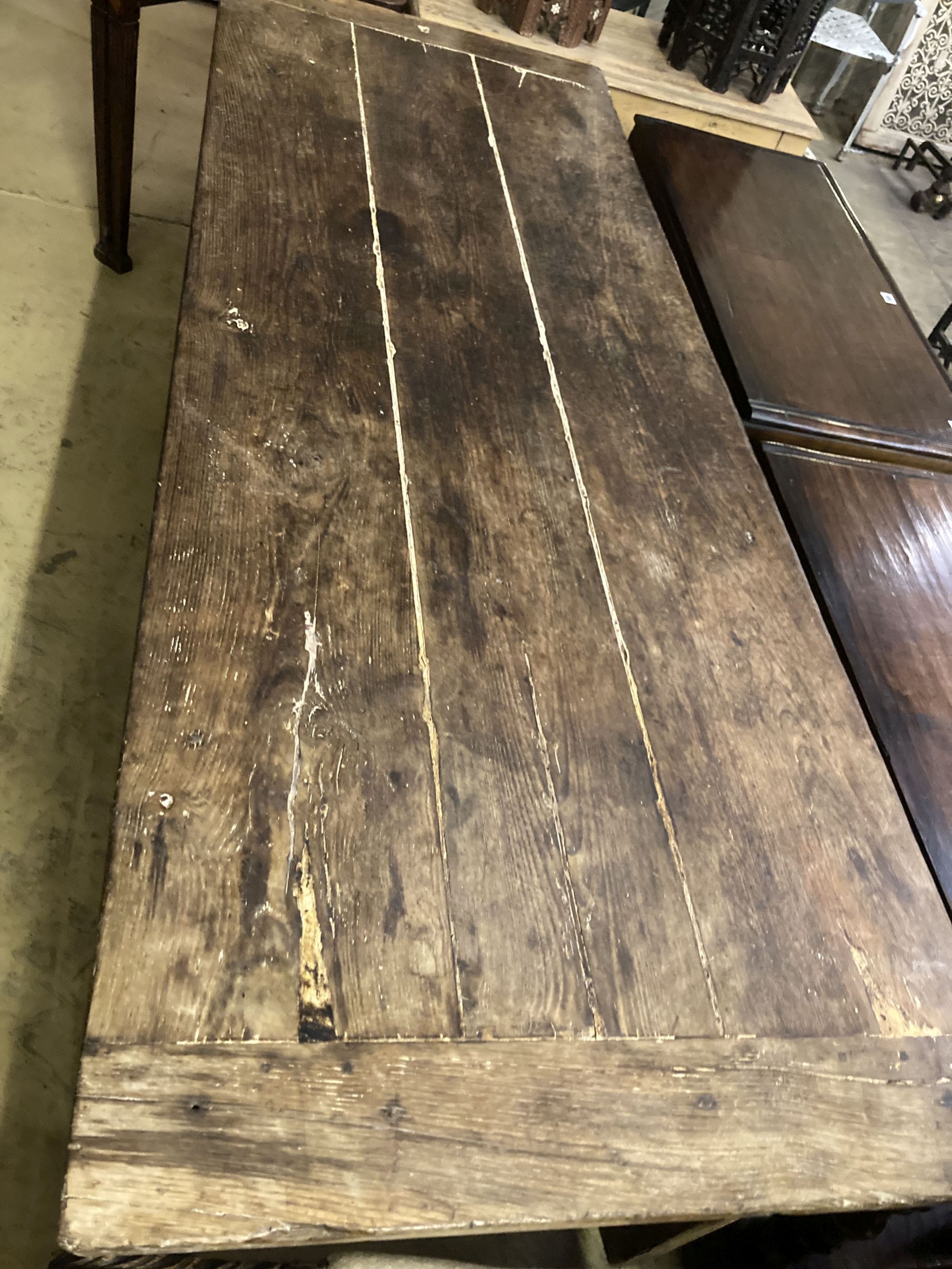 An early 19th century French oak rectangular kitchen table, length 218cm, depth 79cm, height 77cm